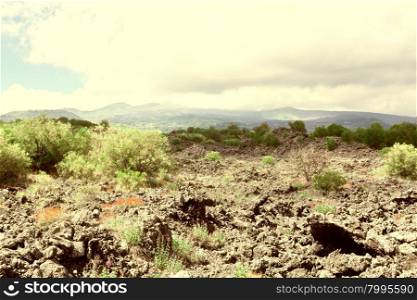 Congealed Black Lava on the Slopes of Mount Etna in Sicily, Vintage Style Toned Picture