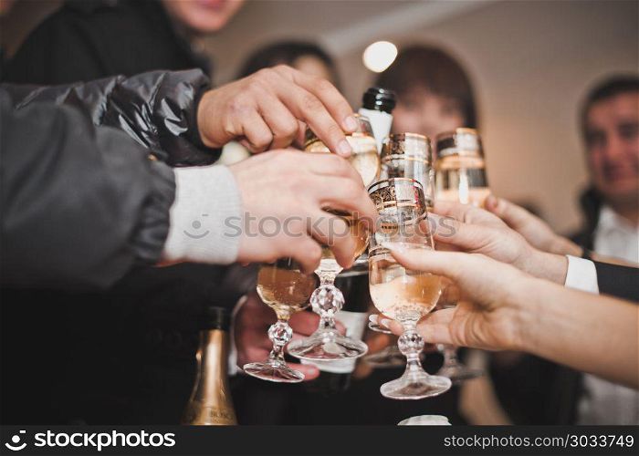 Congratulation on the glasses filled with wine.. Process of a congratulation oProcess of a congratulation oProces