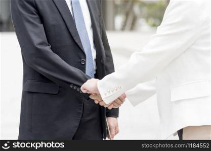Congratulation to collaboration partner after sign on contract. Diverse Businessman shake hands together with businessman to introduce meeting. Trustworthy student friends meeting. Business Concept