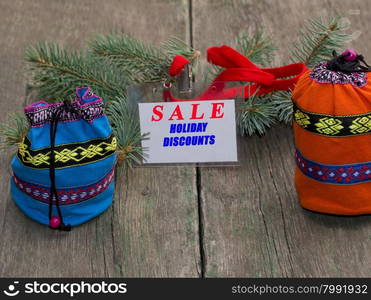 coniferous branch, blue and orange bag, label with an inscription Sale, the subject Christmas and New Year