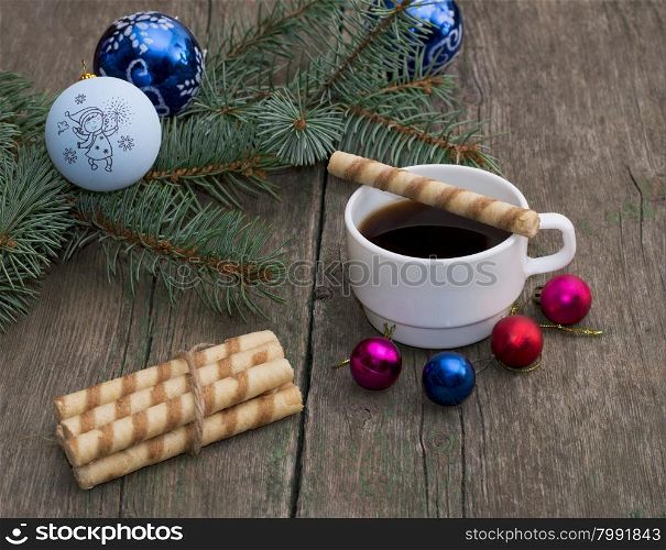 coniferous branch with an ornament, coffee and baking, the subject Christmas and New Year