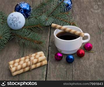 coniferous branch with an ornament, coffee and baking, the subject Christmas and New Year