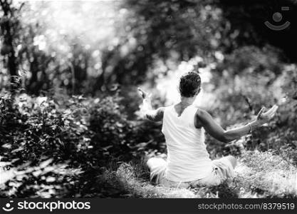 Connecting with Nature, Mindfulness Meditation. A mindful woman meditating, surrounded by beautiful nature. Connecting with Nature, Mindfulness Meditation