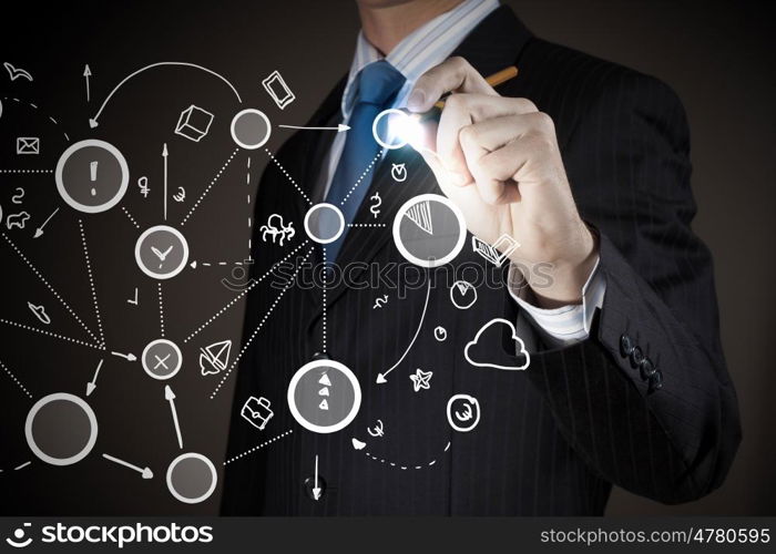 Connection and interaction concept. Chest view of businessman drawing connection lines on screen