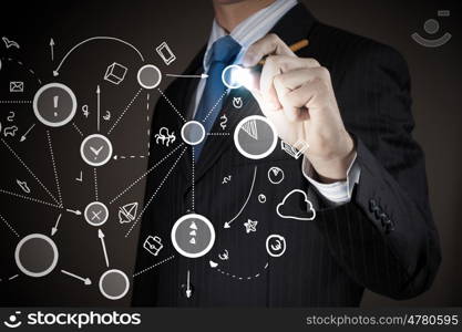 Connection and interaction concept. Chest view of businessman drawing connection lines on screen