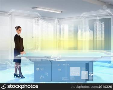 Construction and innovation technologies. Image of young businesswoman standing aside of high-tech picture