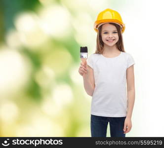 construction and people concept - smiling little girl in protective helmet with paint brush