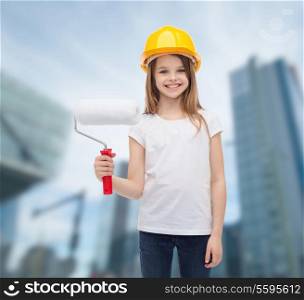 construction and people concept - smiling little girl in protective helmet with paint roller