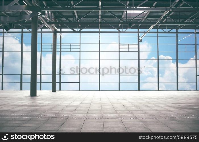construction, architecture and building concept - airport terminal empty room over blue sky and clouds background