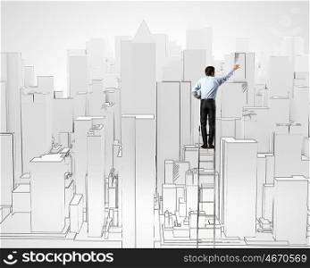 Construction concept. Back view of businessman standing on ladder and drawing buildings