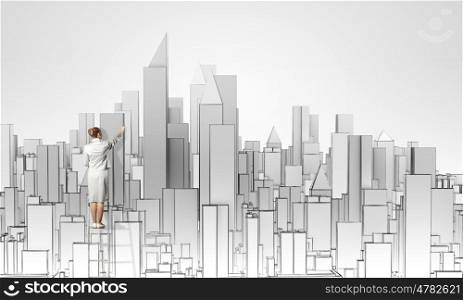 Construction concept. Back view of businesswoman standing on ladder and drawing buildings