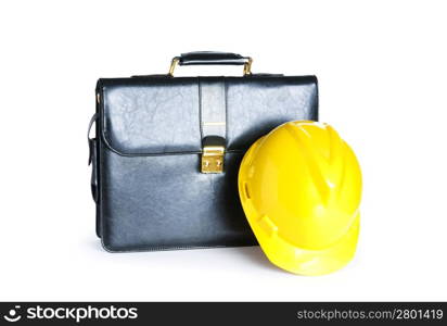 Construction concept - case and hard hat isolated on white