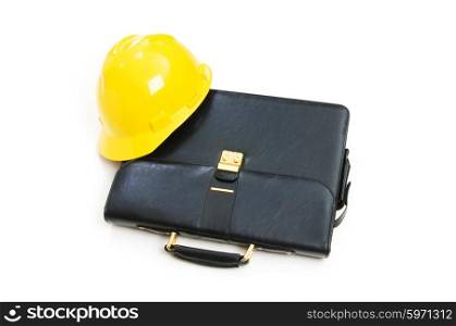 Construction concept - case and hard hat isolated on white