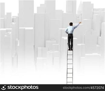 Construction concept. Rear view of businessman standing on ladder and drawing project