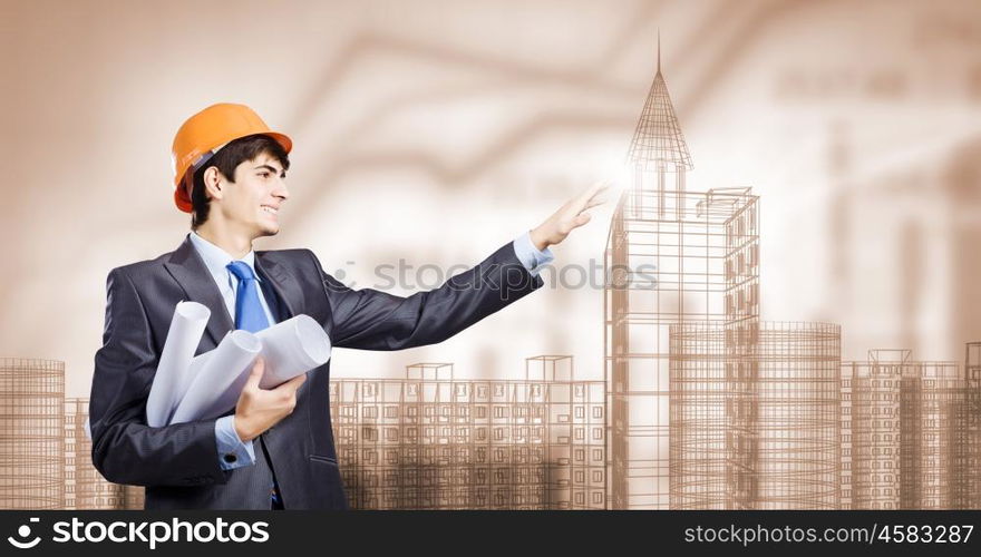 Construction concept. Young man engineer touching icon of media screen