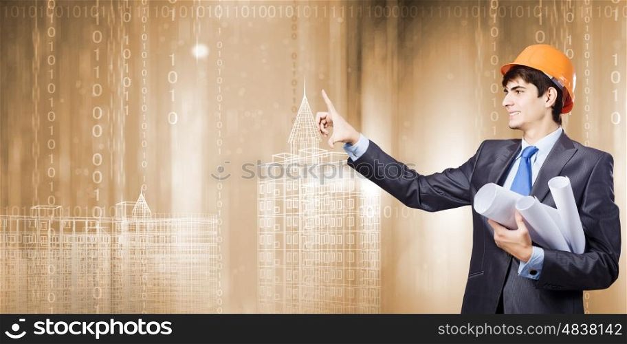 Construction concept. Young man engineer touching icon of media screen