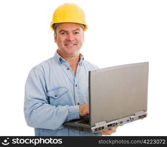 Construction contractor using his laptop. Isolated on white.