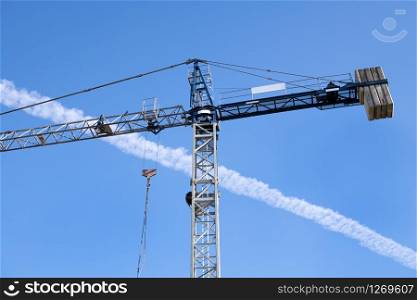 Construction Crane against blue sky. Construction site