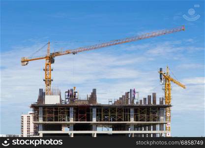 construction crane and worker of building industry with blue sky background