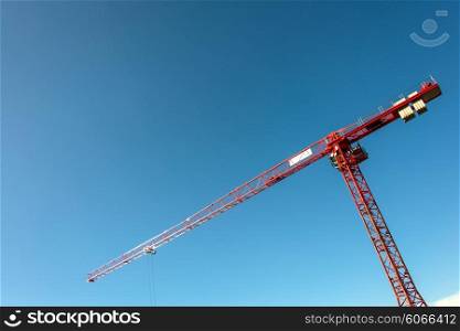 Construction crane on bright summer day