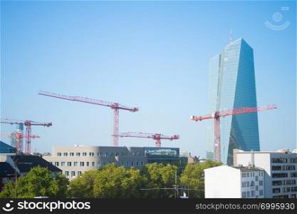 Construction cranes and European Central Bank building. Frankfurt, Germany
