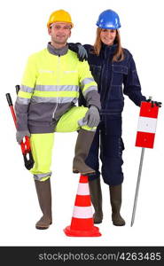 Construction crew with tools and warning signs