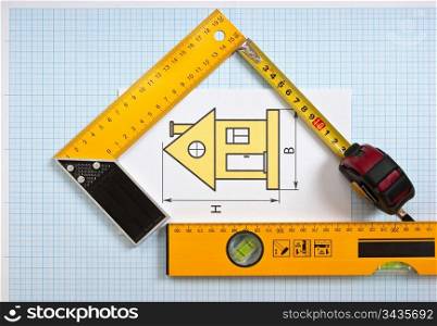 construction drawings and tools on graph paper
