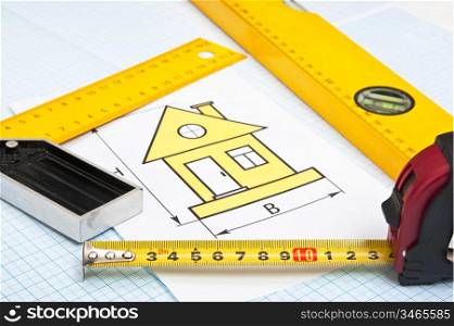 construction drawings and tools on graph paper