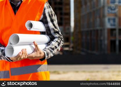 construction engineer holding plans hands. High resolution photo. construction engineer holding plans hands