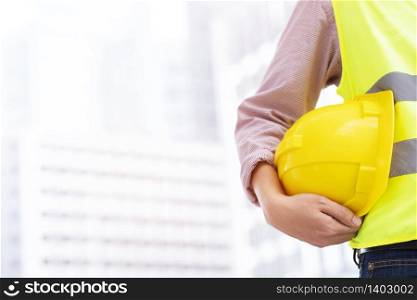 Construction engineer in Safety Suit Trust Team Holding White Yellow Safety hard hat