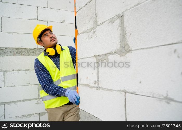 Construction engineer is measuring on construction site,Engineers are working on the construction site.