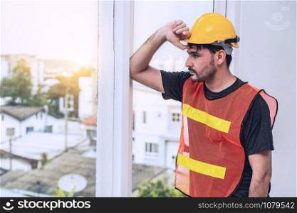 Construction engineer worker working in office. Real estate building contractor business concept.
