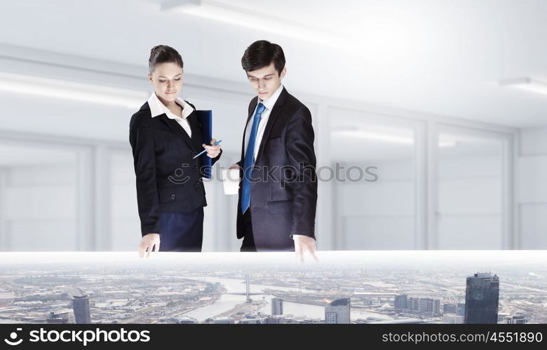 Construction engineering. Two business people examining design of construction model