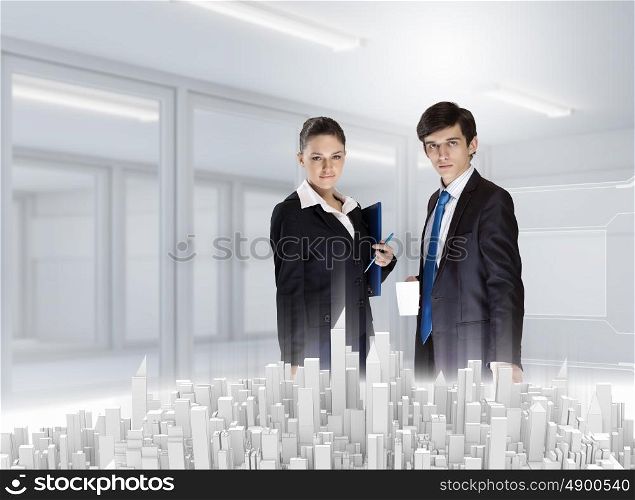 Construction engineering. Two business people examining design of construction model