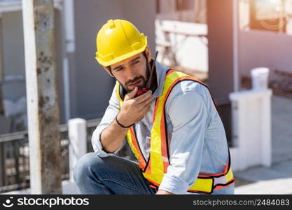 Construction engineering worker talking on radio,Construction engineer use radio communication at construction site.