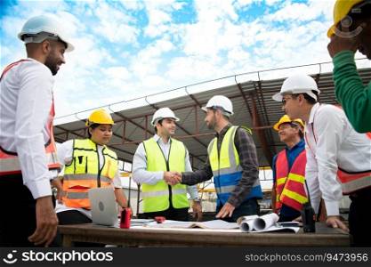 Construction engineers, architects, and foremen form a group. Participate in a meeting to plan new construction projects. Shake hands in thanks for the successful completion of the responsible work.