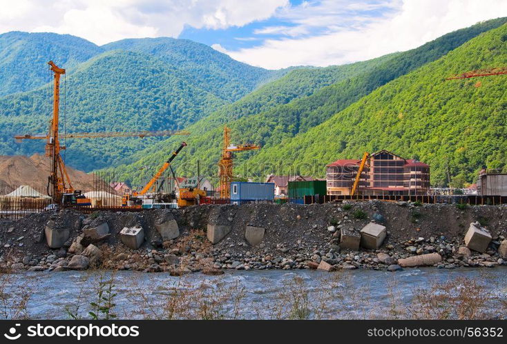 Construction equipment at a construction site on the banks of the river