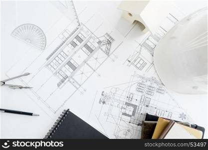 Construction equipment. Repair work. Drawings for building Architectural project, blueprint rolls and divider compass on table. Engineering tools concept with copy space