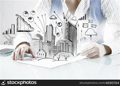 Construction expertise concept. Close view of woman examining with magnifying glass architectural project