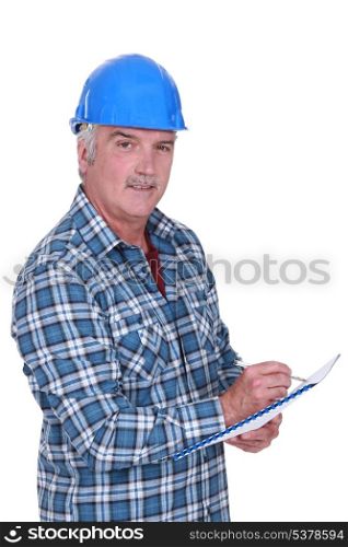 Construction foreman evaluating an employee