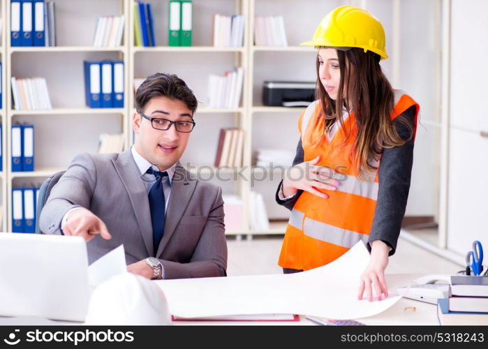 Construction foreman supervisor reviewing drawings