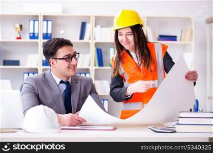 Construction foreman supervisor reviewing drawings