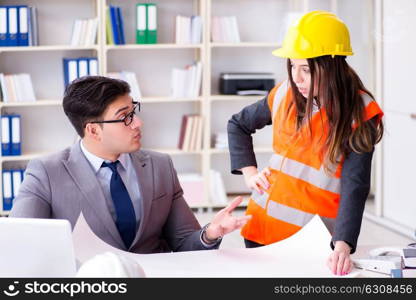 Construction foreman supervisor reviewing drawings