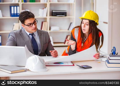 Construction foreman supervisor reviewing drawings