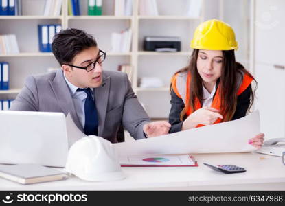 Construction foreman supervisor reviewing drawings