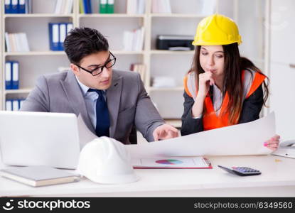 Construction foreman supervisor reviewing drawings