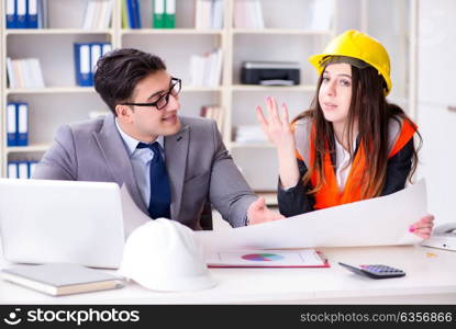 Construction foreman supervisor reviewing drawings
