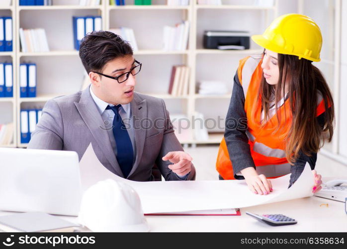 Construction foreman supervisor reviewing drawings