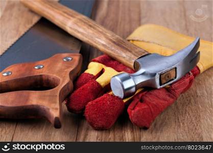 Construction gloves and hammer. Construction gloves and hammer on a white background