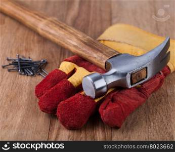 Construction gloves and hammer. Construction gloves and hammer on a white background